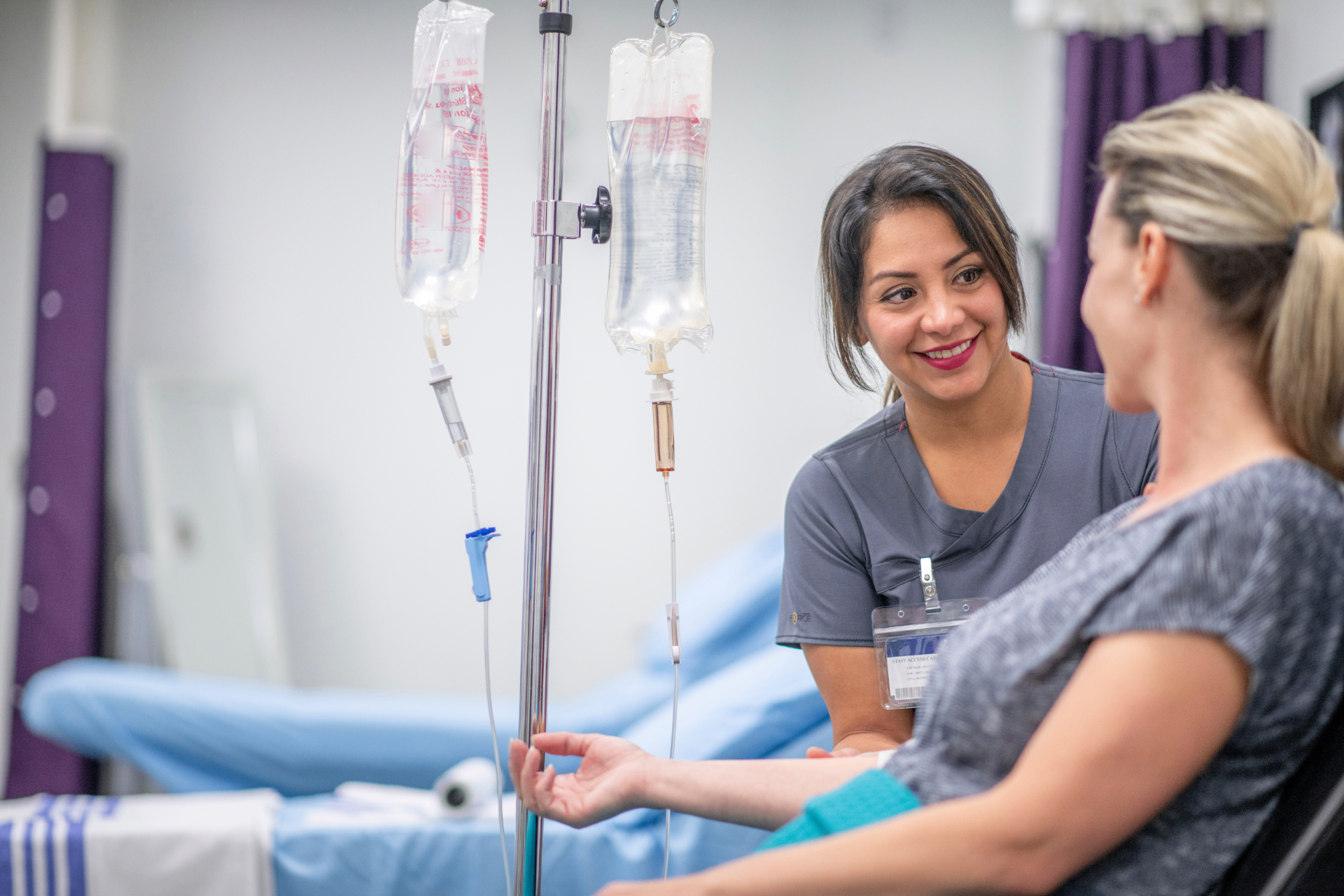 Registered Nurse with a guest during a stem cell IV infusion at iCRYO Branford